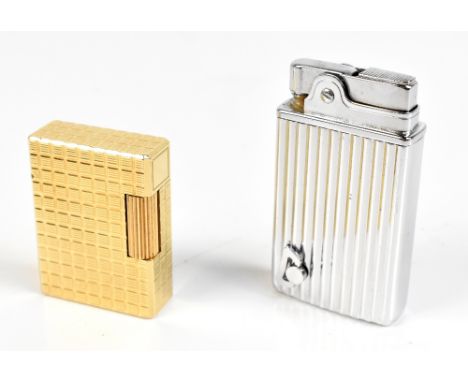 S.L. DUPONT; a French cigarette lighter, 5 x 3.5cm, and a Crown musical example (2).Additional InformationGeneral wear throug