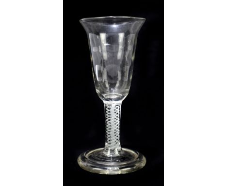 A Georgian air twist wine glass, the bell shaped bowl raised on opaque air twist stem, terminating on folded foot, height 16c