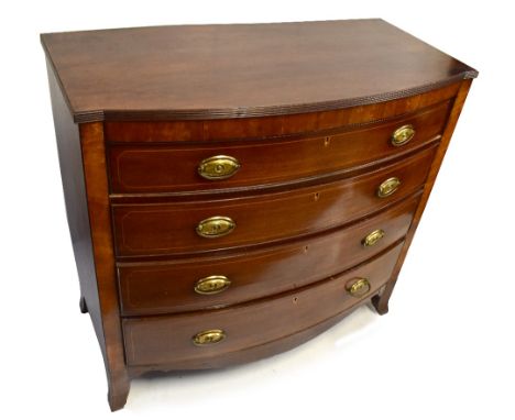 An early 19th century mahogany bow fronted chest of four long boxwood strung drawers on splayed bracket feet, width 115cm, de