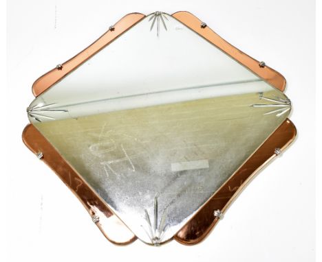 An Art Deco peach glass shaped wall mirror, 60 x 60cm.Additional InformationSome scratches, scuffs, stains and spotting to th