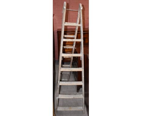 A vintage set of pine step ladders.Additional InformationThese items are for display purposes only, heavy wear throughout.