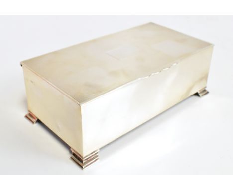 WH MANTON; a George V hallmarked silver cigarette case of rectangular form, the hinged cover with engine turned detail surrou