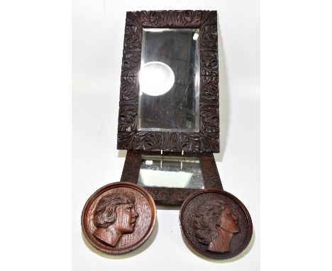 Two Macclesfield School of Carving oak framed rectangular wall mirrors, the larger with bevelled glass 59.5 x 39cm, the small
