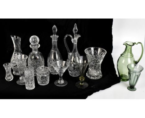 A quantity of glassware including a Powell for Whitefriars pale green tinted style trumpet shaped glass, three decanters and 