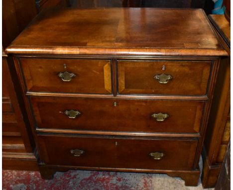 A good quality reproduction walnut chest of two short over two long drawers on bracket feet, height 80cm, width 86cm, depth 5