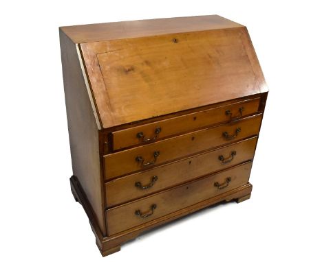 An early 19th century mahogany bureau, the fall front enclosing fitted interior above an arrangement of four drawers on brack