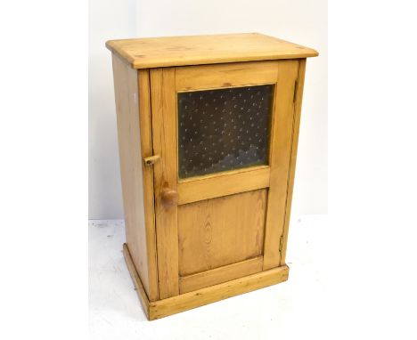 A pine single door cupboard with glazed upper section, panelled beneath and single shelf to the interior, width 50cm.Addition