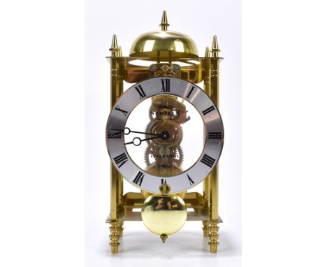 SEWILLS OF LIVERPOOL; a modern brass skeleton mantel clock, the applied silver coloured plastic dial with Roman numerals, hei