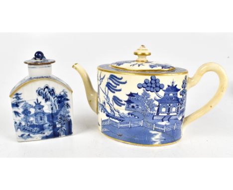 An 18th century Chinese porcelain tea caddy with arched top, painted in Willow pattern with associated cover, height 12cm, an