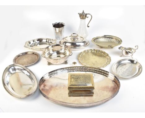 A group of silver plated items comprising an oval galleried tray, a lidded terrine, further dishes, an ice bucket with swing 