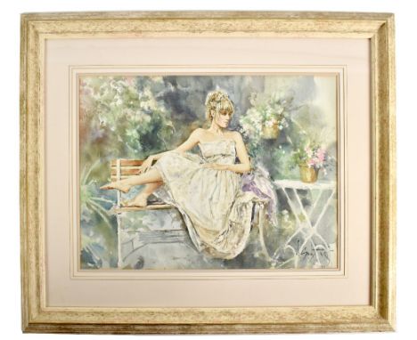 GORDON KING (born 1939); watercolour, study of a lady reclining on a bench in garden setting, signed lower right, 40 x 56cm, 