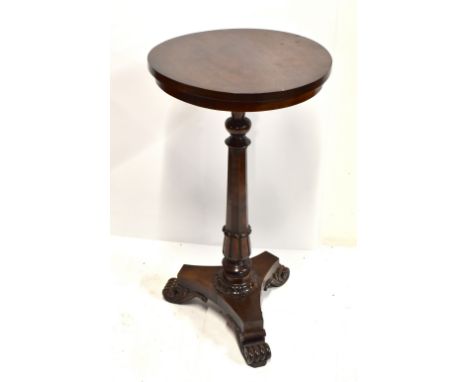 A William IV mahogany circular tripod table on fluted column supports, height 73cm, diameter 39cm.