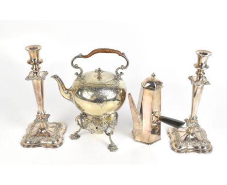 A silver plated spirit kettle on stand, a pair of plated candlesticks and a silver plated coffee pot with side handle.Additio