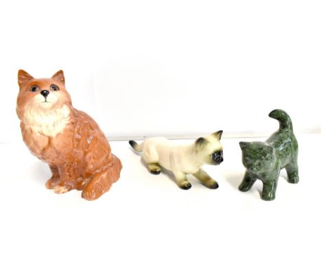 BESWICK; a model of a seated cat no. 1867, height 20cm, a ceramic model of a Siamese cat, and a further cat (3).Additional In