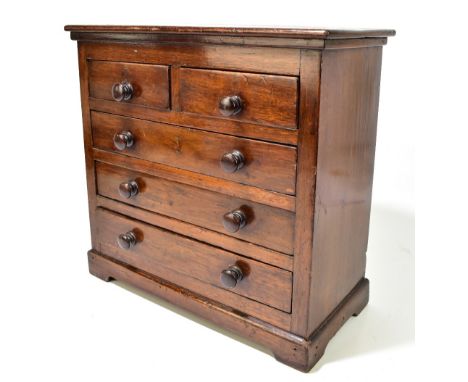 A 19th century mahogany tabletop apprentice chest of two short and three long drawers on bracket feet, height 41.5cm, width 4
