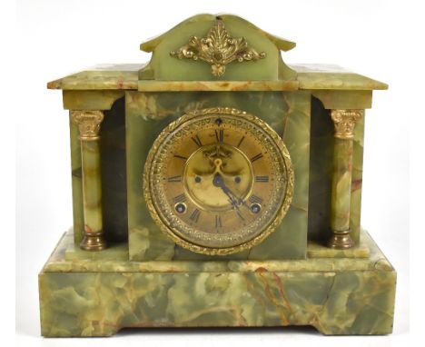 A c1900 French onyx eight day mantel clock of architectural form, the gilt chapter ring set with Roman numerals with gilt met