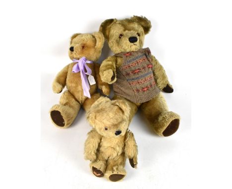 CHAD VALLEY; a large c1950s golden mohair teddy bear dressed in cardigan, length 60cm, a 1960s example and further smaller ex