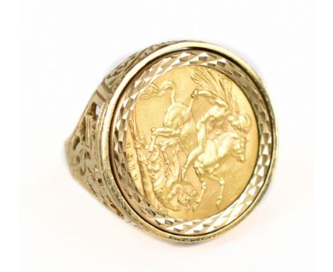 A George V full sovereign, 1911, set in a 9ct yellow gold ring with pierced detail to shoulders and initials 'RH', size S 1/2