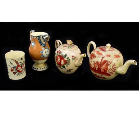 Four pieces of 18th century creamware to include a baluster form jug with mythical beast spout, probably Leeds, painted with 