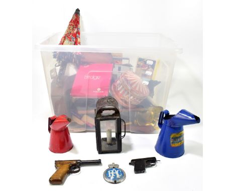 A group of collectors' items including two oil cans, one bearing 'Duckhams' decal, and a RAC badge, a boxed Webley Sports sta