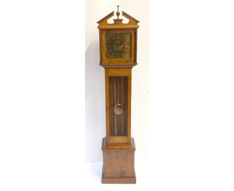 A reproduction oak cased longcase clock of small proportions, the brass dial inscribed ‘Paul Eden Llanbedr’ and ‘E. J. Fox’, 