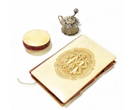 An ivory mounted needle case with carved initials ‘BM’, 8 x 5.5cm, a similar pin cushion with matching initials and a white m