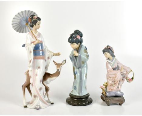 LLADRO; three Japanese figures comprising 06396 ‘Oriental Forest’, 1.447 lady with basket of flowers and girl bowing in respe