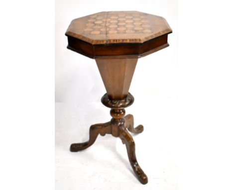 A late Victorian walnut sewing box, the octagonal hinged top with chess inlay on tripod supports (af).Additional InformationT