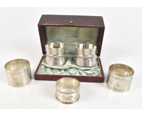 CHARLES BOYTON &amp; SON LTD; a pair of George V hallmarked silver napkin rings with engine turned detail and engraved initia