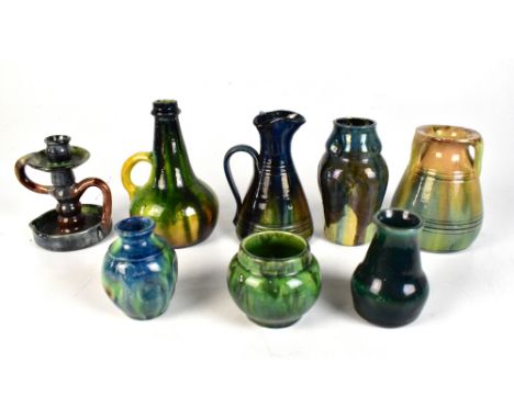 Eight pieces of Belgian and Continental art pottery to include a Dutch wine bottle shaped ewer, height 19cm, etc (8).Addition