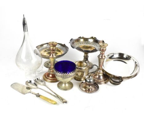 A group of electroplated items including a pierced pedestal dish with swing handle, a further example on stepped circular bas