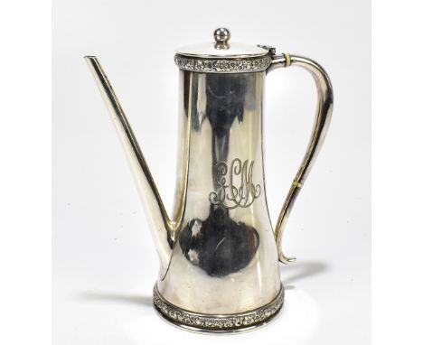 TIFFANY &amp; CO; a silver plated coffee pot of inverse tapered form with bands of cast foliate detail and ivory insulators, 