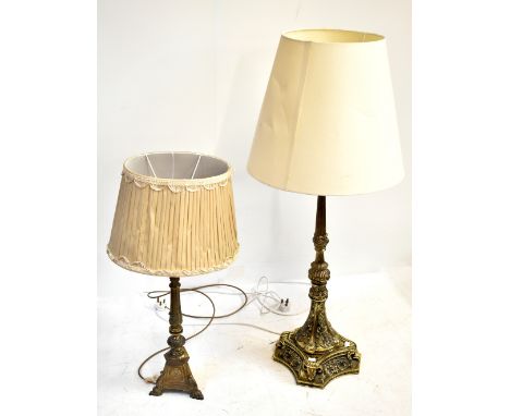 A large ornate decorative brass lamp, height 74cm, and a smaller example, height 50cm.