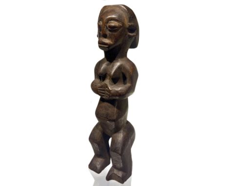 Wooden figurine of "fertility" trunk. Ivory Coast, the 20th century, 30x8x7 cm.