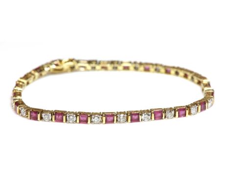 A ruby and diamond line bracelet,with a row of alternating square cut rubies and brilliant cut diamonds. Each ruby end set to