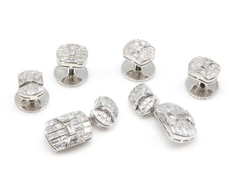 A diamond set cufflink and dress stud set,with graduated barrel shaped plates. The chain link cufflinks with rows of baguette