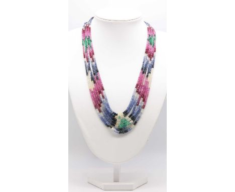 A seven row graduated faceted sapphire, ruby and emerald bead necklace,2.80 to 5.00mm in size, strung plain to an adjustable,