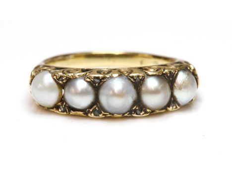 A Victorian five stone split pearl and diamond ring,with five split pearls, claw set to a carved head, with rose cut diamond 