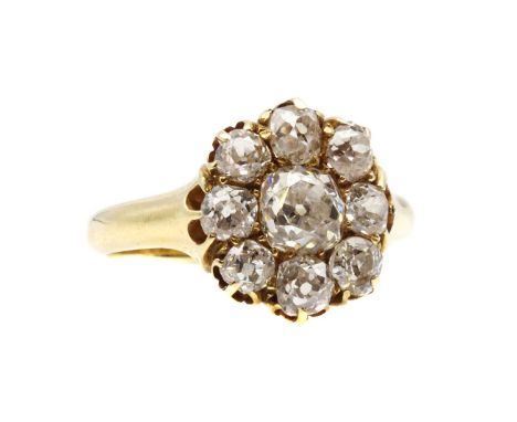 A Victorian gold diamond cluster ring, with an old mine cut diamond grain set at the centre, to surround of smaller old mine 