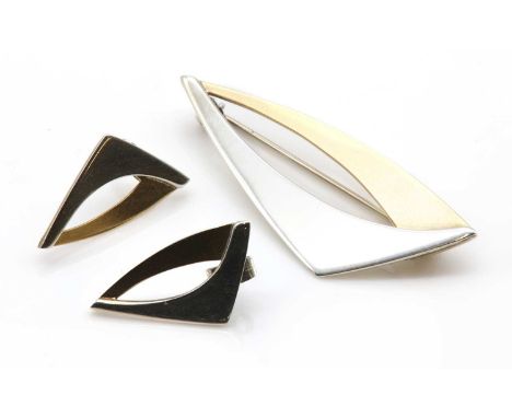 A sterling silver and gold brooch and earring suite, by David Fowkes,of open triangular or sail form, with polished sterling 