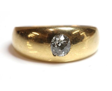 A gentlemen's 18ct gold single stone diamond ring,with an oval old European cut diamond, gypsy set to a tapered head, Birming