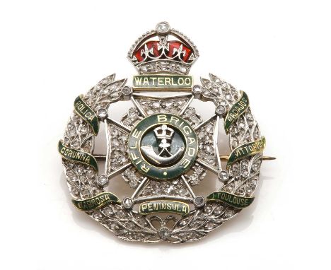 A two colour gold Rifle Brigade diamond and enamel regimental brooch,graduated rose cut diamonds pavé set to the Maltese cros