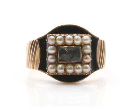 A Georgian gold memorial ring,woven hair to a glazed panel, with a border of split pearls in clawed collets, to a black ename