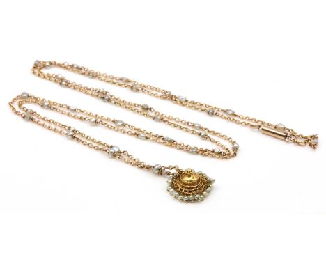 A late Victorian pearl set long chain, with an Indian high carat gold seed pearl pendant. The trace chain with baroque pearls