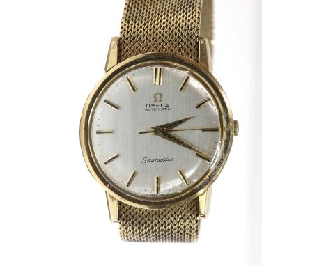 A gentlemen's 9ct gold Omega 'Seamaster' automatic bracelet watch, c.1960,with a 34mm case, a silvered dial, raised black and