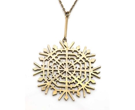 A 9ct gold snowflake pendant, by Deakin and Francis, c.1970,with a flat section pierced snowflake, articulated from a square 