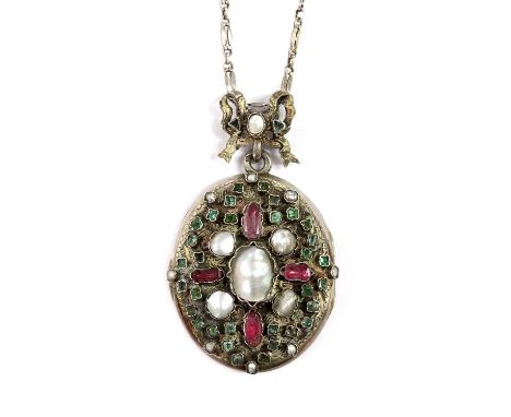 An Austro-Hungarian gem set oval hinged locket, c.1930,on a watch chain, c.1930. The locket with an oval blister pearl in a c