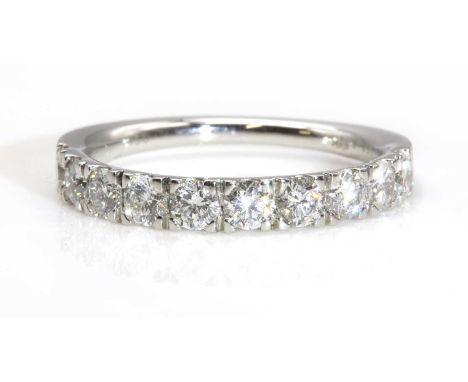 A diamond set half eternity ring,with a row of brilliant cut diamonds with a stated total weight of 1.00ct. All four claw set