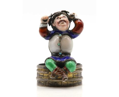 An Austrian silver gilt desk enamelled seal c.1900, in the form of a bacchant figure sitting on a keg or barrel. The figure d