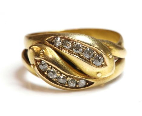 A gentlemen's 18ct gold diamond set snake or serpent ring,with a pair of entwined snakes, all set with a row of graduated old